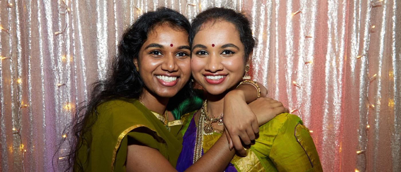 Two College of 整骨疗法的医学 students embracing at the Diversity Gala